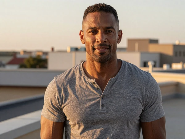 Marcus, 42, EvaDate success story member on a rooftop at sunset